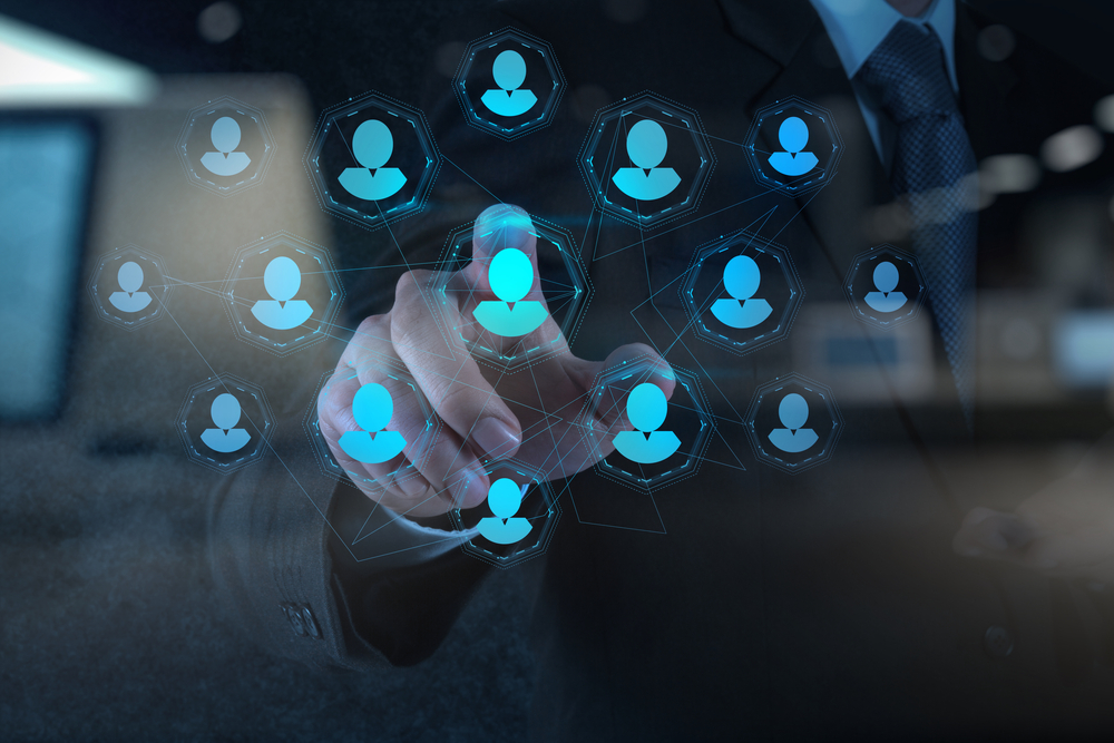 Double exposure of businessman hand points human resources, CRM and social media as concept Double exposure of businessman hand points human resources, CRM and social media as concept